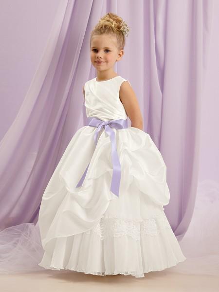 This precious flower girl dress has a floor length skirt of lace and pleated organza ruffles. Many bridal gowns have the same features and now we’ve got the flower girl dress to match! As always, the ribbon sash can be ordered in a variety of colors. Swing by to take a closer look at it! Premier Bride's Perfcet Dress